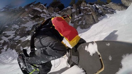 Jeremy Jensen hiking a couloir with his Grassroots Powsurfer and help from Verts, the lightest and most efficient backcountry ascent tool.